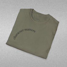 Load image into Gallery viewer, character matters Unisex T-Shirt by B E-Z
